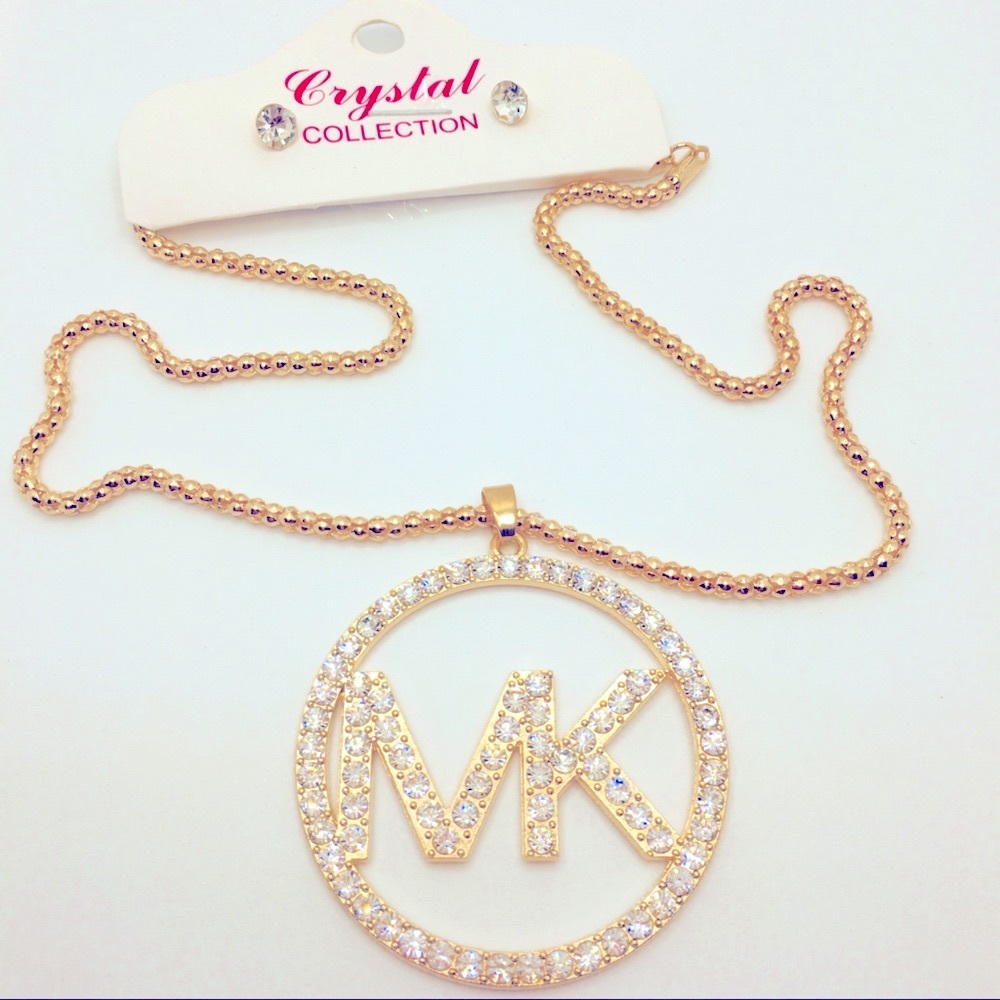 NECKLACE CRYSTAL MK ON GOLD TONE CHAIN!